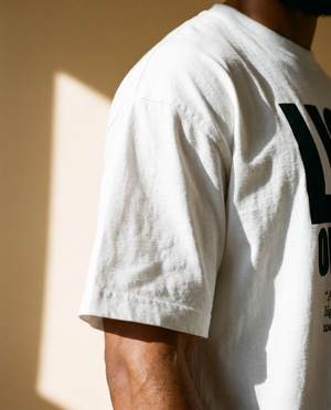 Light of the World tee, white, front print, man, sleeve close up