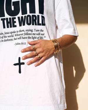 Light of the World tee, white, front print, woman, hand on chest close up