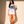 Light of the World tee, white, front print, woman, leaning on wall full body