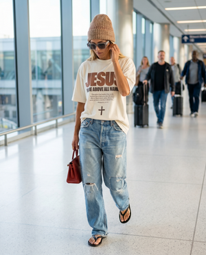 Jesus - Name Above All Names in White – Woman in airport in The Word T-Shirt