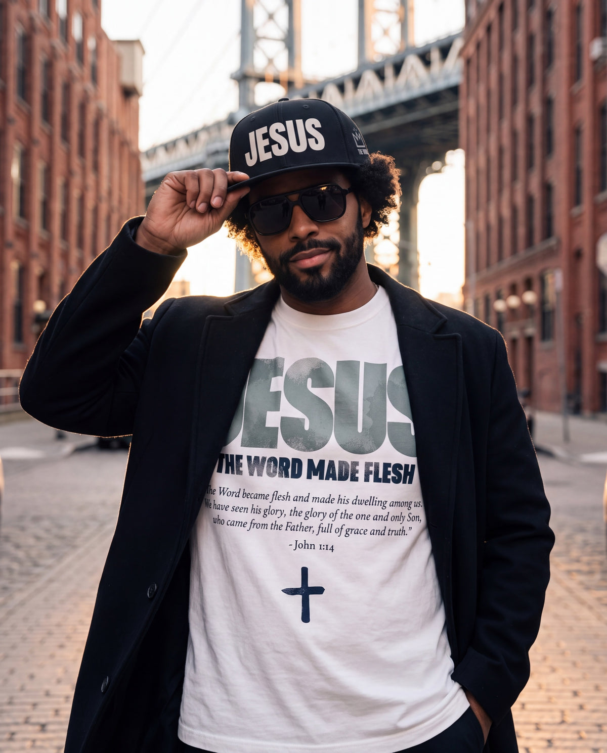 Man in a JESUS snapback under the Manhattan Bridge in Dumbo, The Word headwear