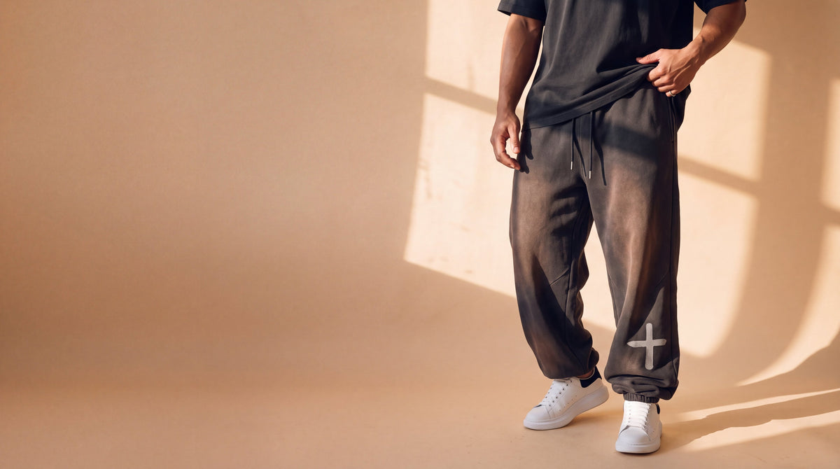 Smoky black heavyweight sweatpants from the waist down in the studio, The Word