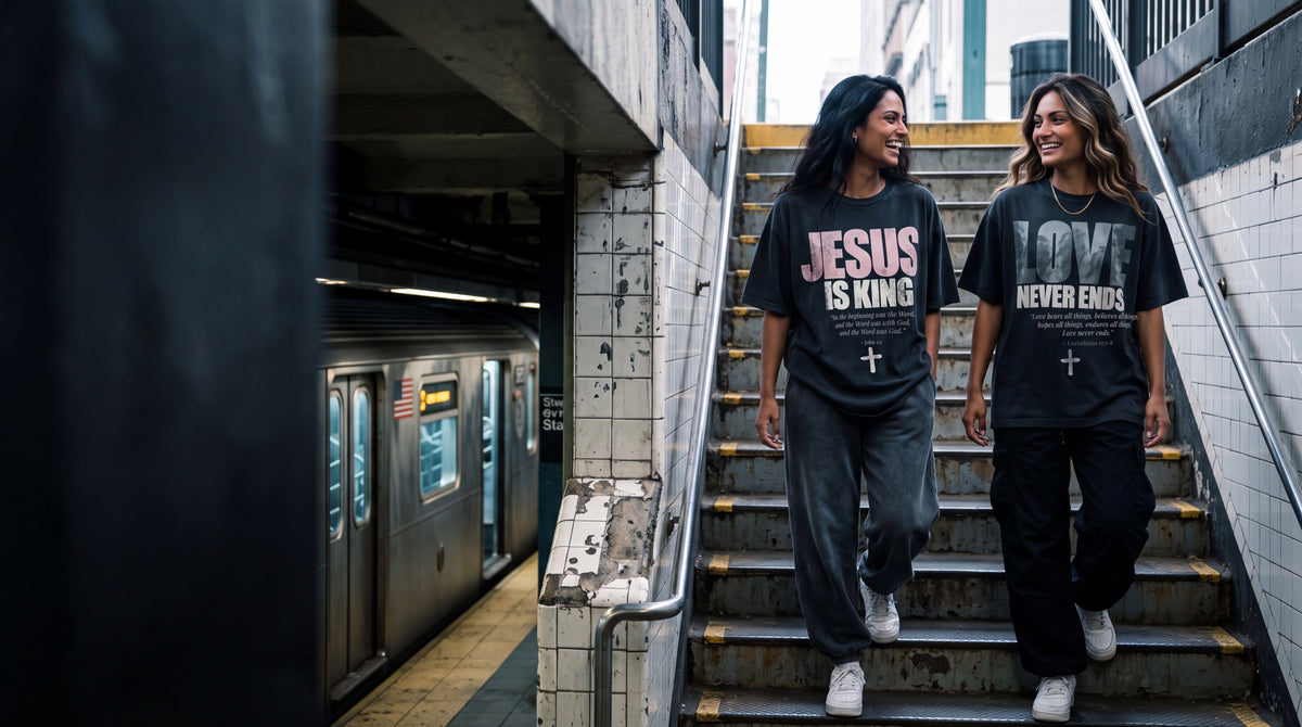 Two women in the Jesus Is King and Love Never Ends tees on New York subway stairs, The Word