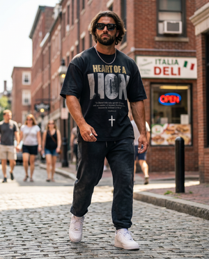 Heart of a Lion – Man walking in black Christian T-Shirt by The Word