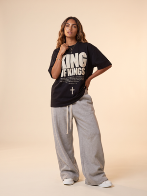 King of Kings MONOCHROME tee, black, front print, woman, hand on hip