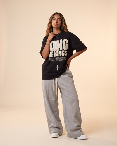 King of Kings MONOCHROME tee, black, front print, woman, hand on hip