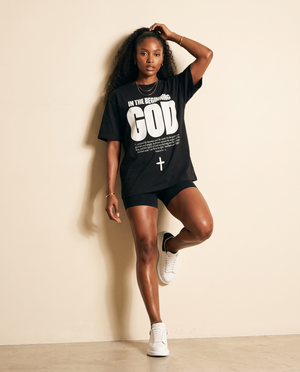 In The Beginning God MONOCHROME tee, black, front print, woman, leg up hand in hair