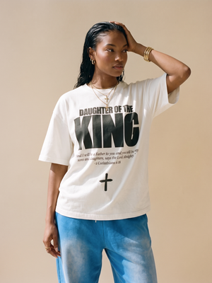 Daughter of the King tee, white, front print, woman, hand on head thigh up