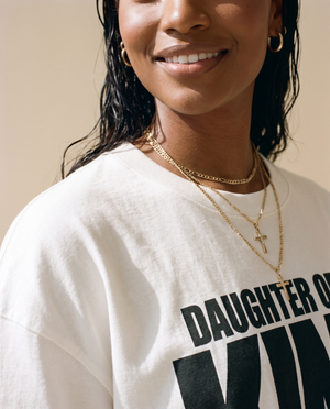 Daughter of the King MONOCHROME tee, white, woman, front print close up with gold cross necklace