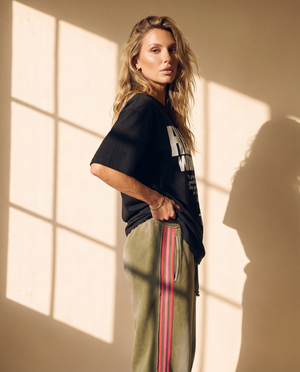 Heart Wide Open tee, black, front print, woman, side profile
