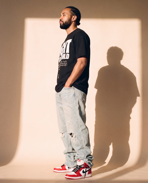 Light of the World tee, black, front print, man, side profile full body