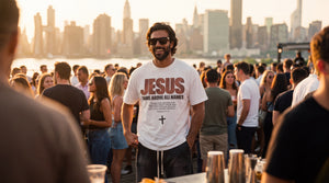 Man in Jesus Name Above All Names tee at a rooftop gathering with the Manhattan skyline