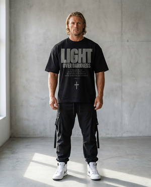 Light Over Darkness Black Tee – Man wearing The Word t-shirt
