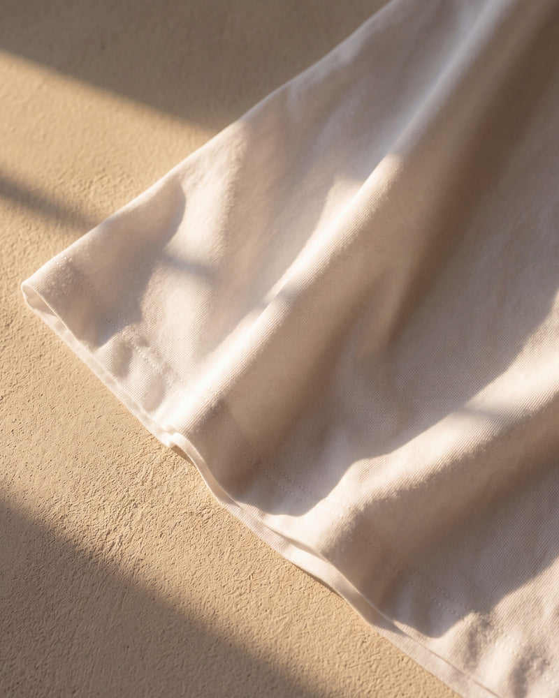 Even reactive-dyed colour on a white 240 gsm The Word tee in warm sunlight