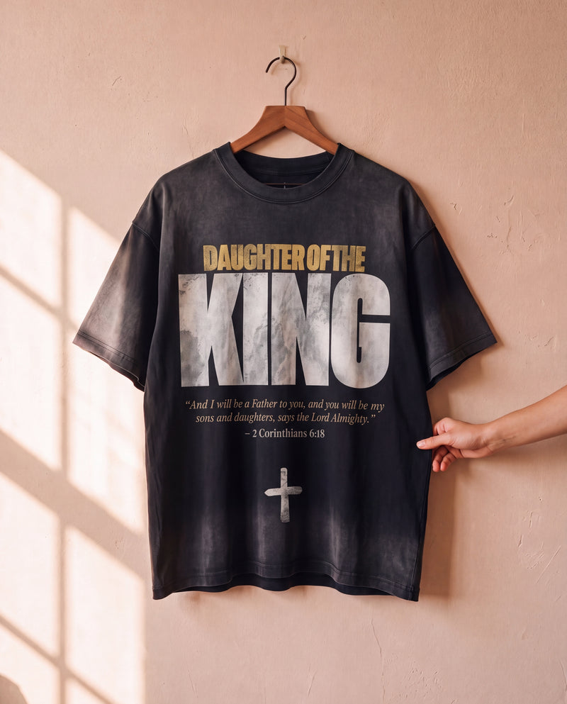 Daughter of the King faded black tee on a hanger, front print