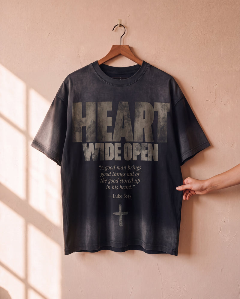 Heart Wide Open faded black tee on a hanger, front print