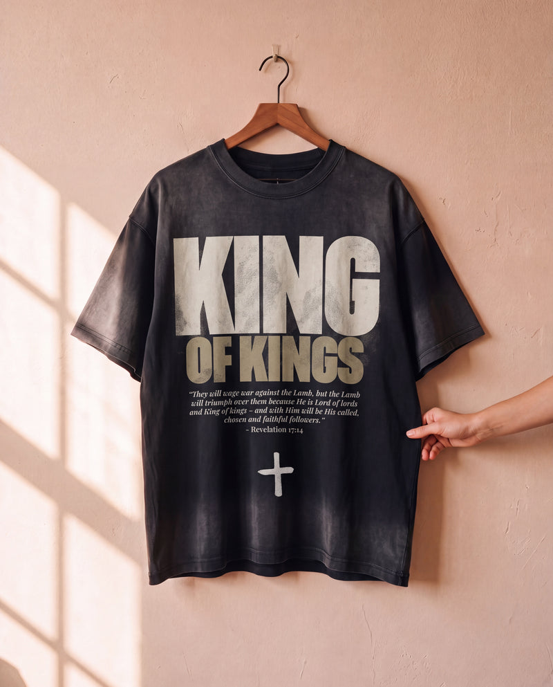 King of Kings faded black tee on a hanger, front print