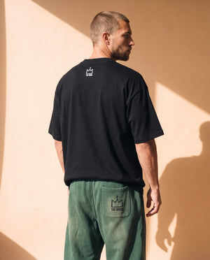 Light Over Darkness tee, black, back print, man, back view look over