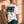 Light Over Darkness tee, white, back print edition, man, back print look over thigh up