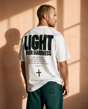 Light Over Darkness tee, white, back print edition, man, back print look over thigh up
