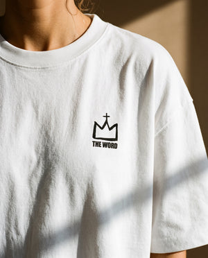 Light Over Darkness tee, white, back print edition, woman, front crown chest close up