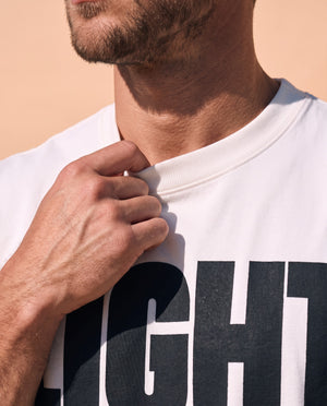 Light Over Darkness tee, white, front print, man, collar close up