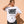 Light Over Darkness tee, white, front print, woman, hand on hip thigh up