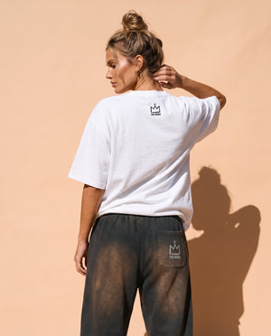 Light Over Darkness tee, white, back print, woman, back view look over