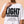 Light Over Darkness tee, white, front print, woman, chest close up