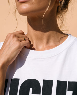 Light Over Darkness tee, white, front print, woman, collar close up