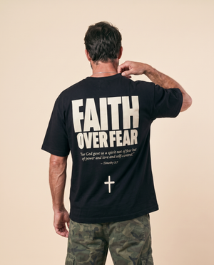 Faith Over Fear MONOCHROME tee, black, back print edition, man, hand in hair